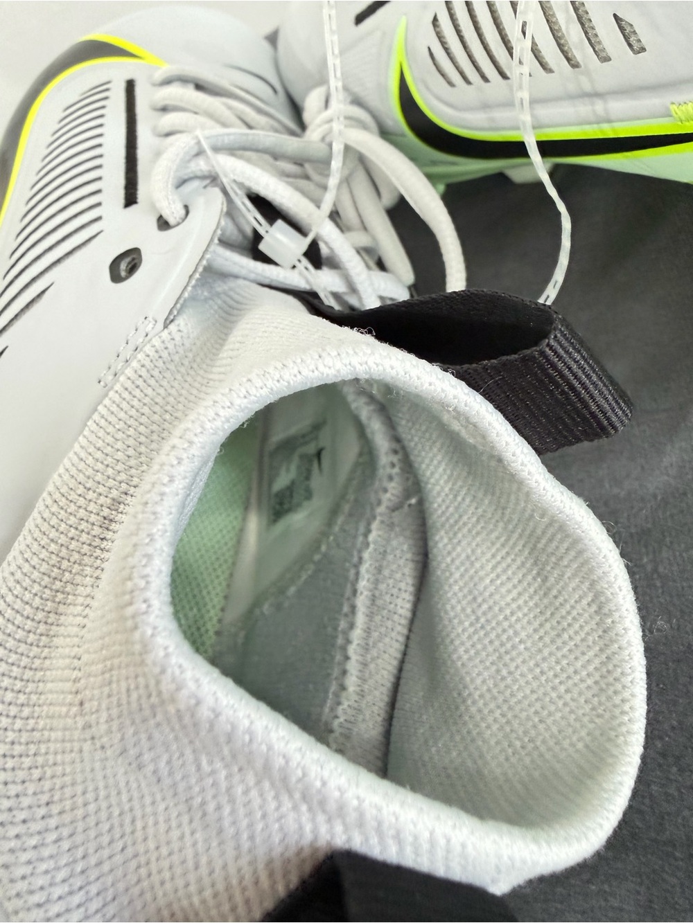 Nike Men’s White Athletic Cleats with Neon Yellow Accents - Picture 7 of 10